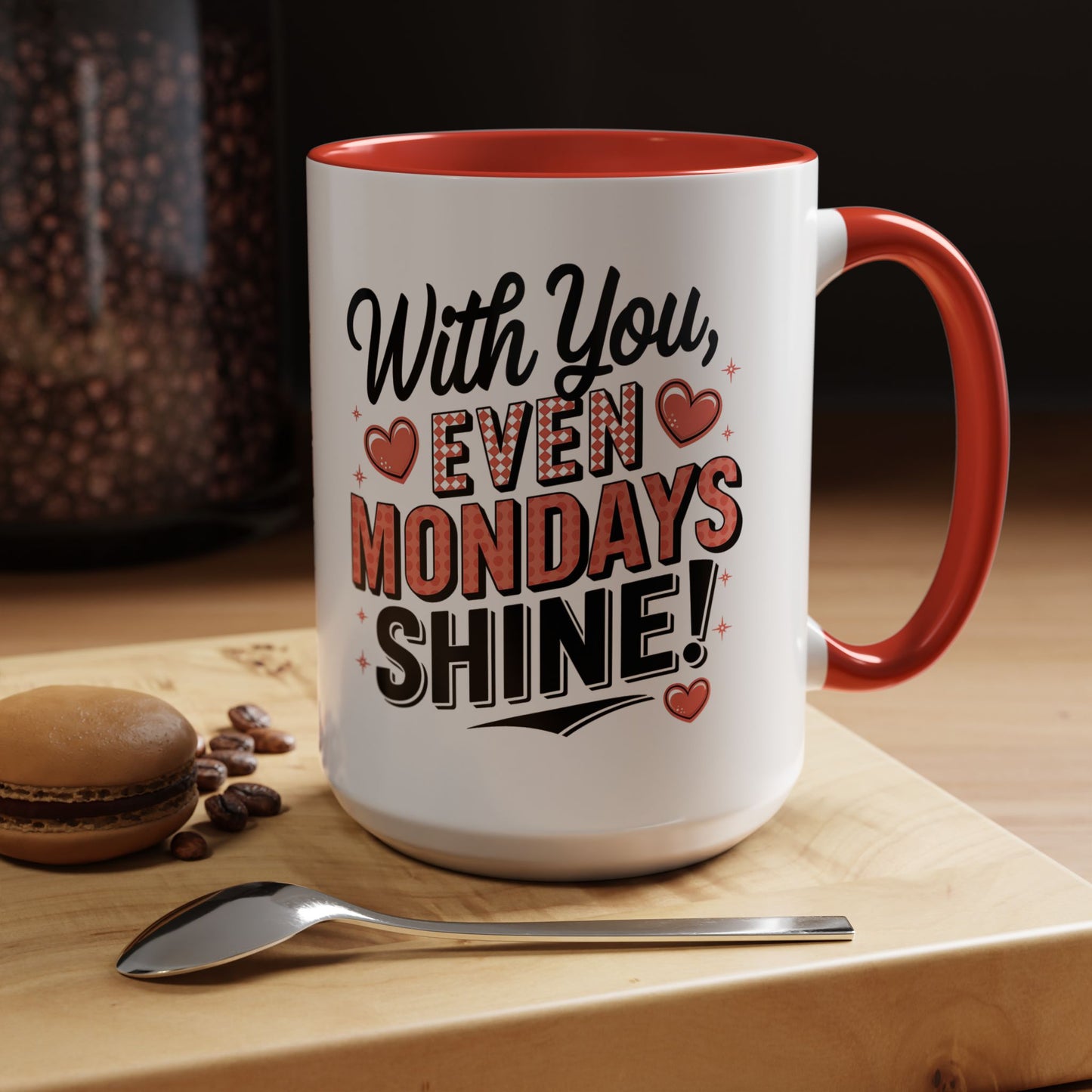 Mug with motivational quote on a wooden surface with coffee beans and a macaron.Accent Coffee Mug — "With You, Even Mondays Shine" Romantic Heart Gift